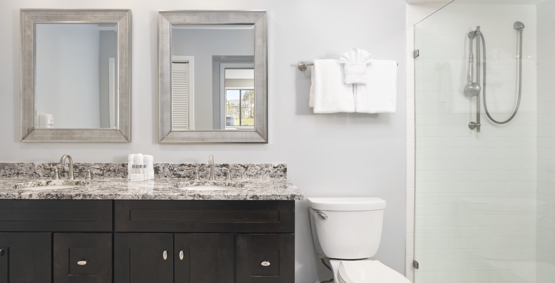 Windsor Court bathroom with a walk-in shower and double sink
