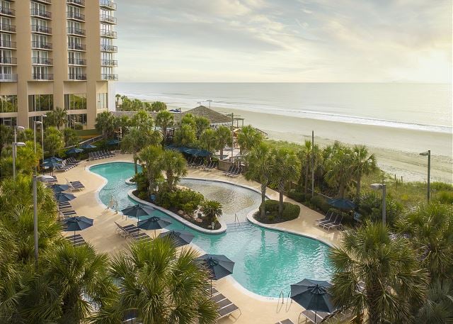 Hilton sand bottom pool and beach view