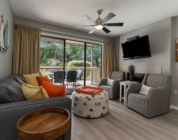 Furnished living area with balcony access