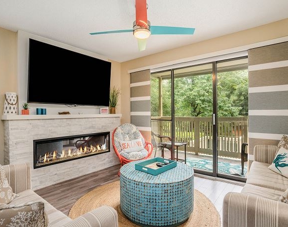 Living area with television and fireplace