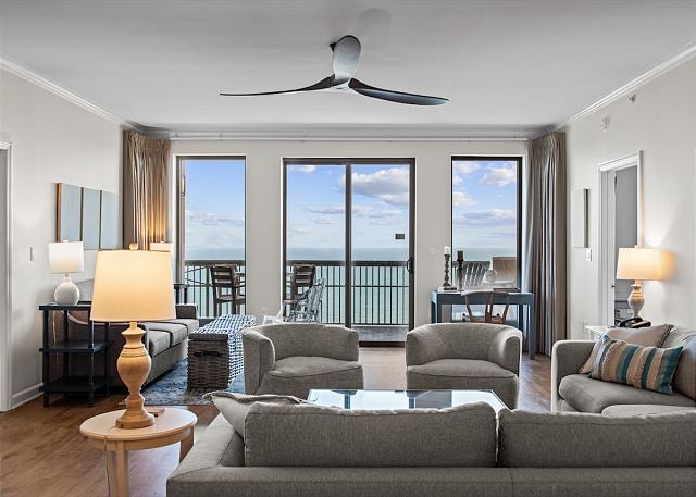 Margate Condo living area with ocean views and balcony access