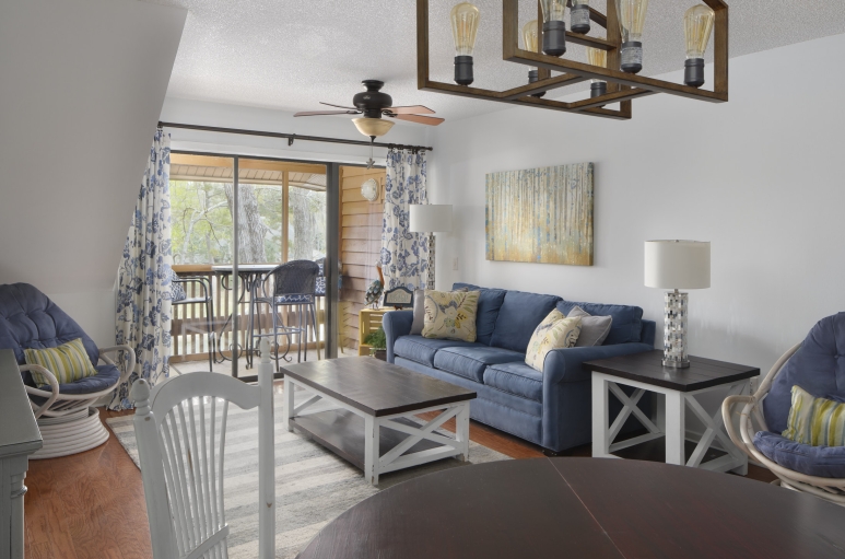 Arrowhead Court living room and dining room with balcony access