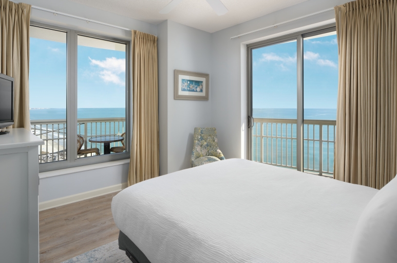 Margate tower bedroom with balcony access and an ocean view