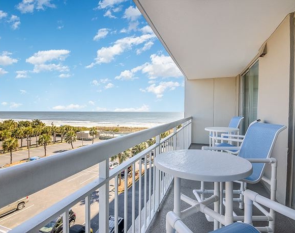 Balcony with tables and chairs
