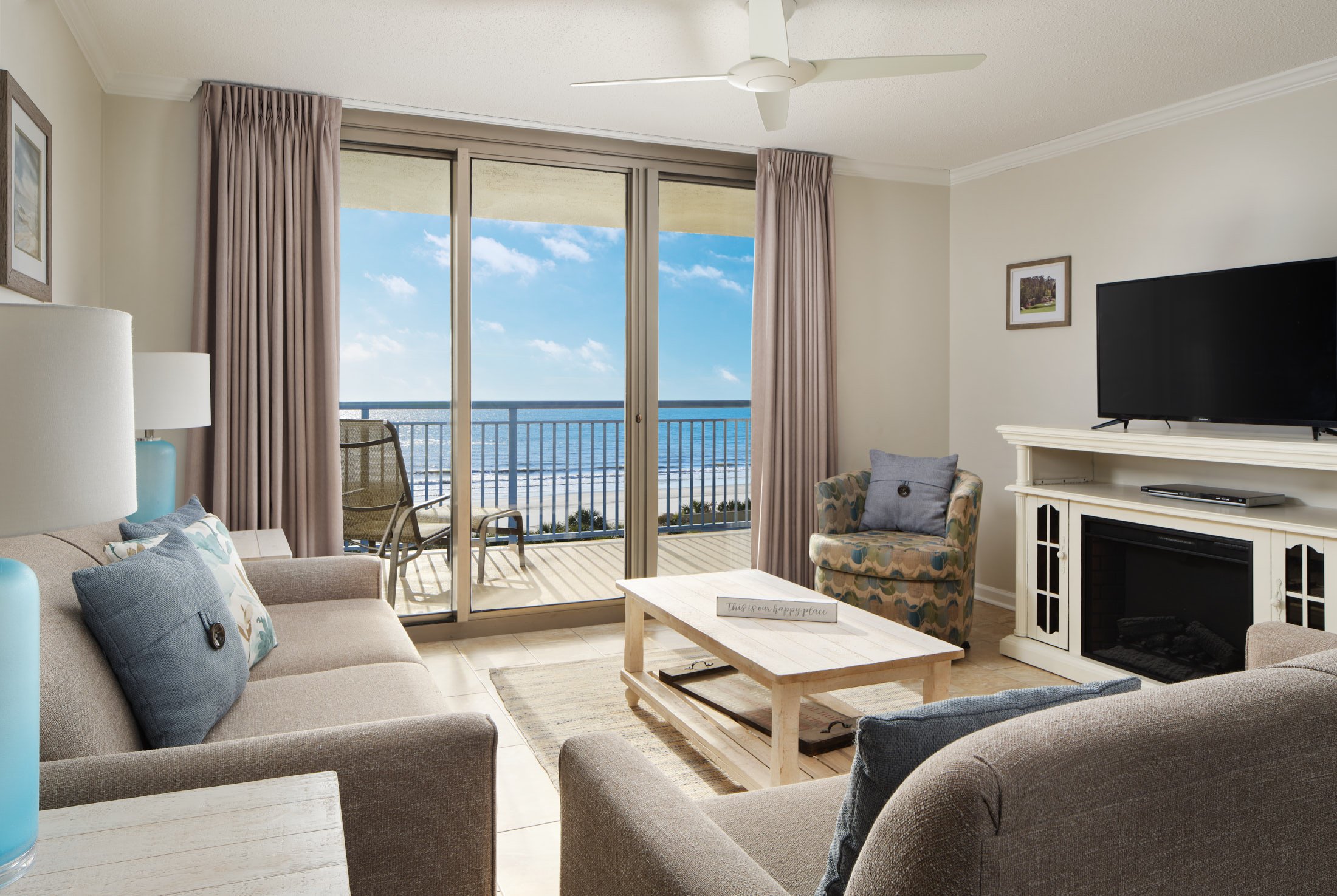 Brighton ocean view living room with balcony access