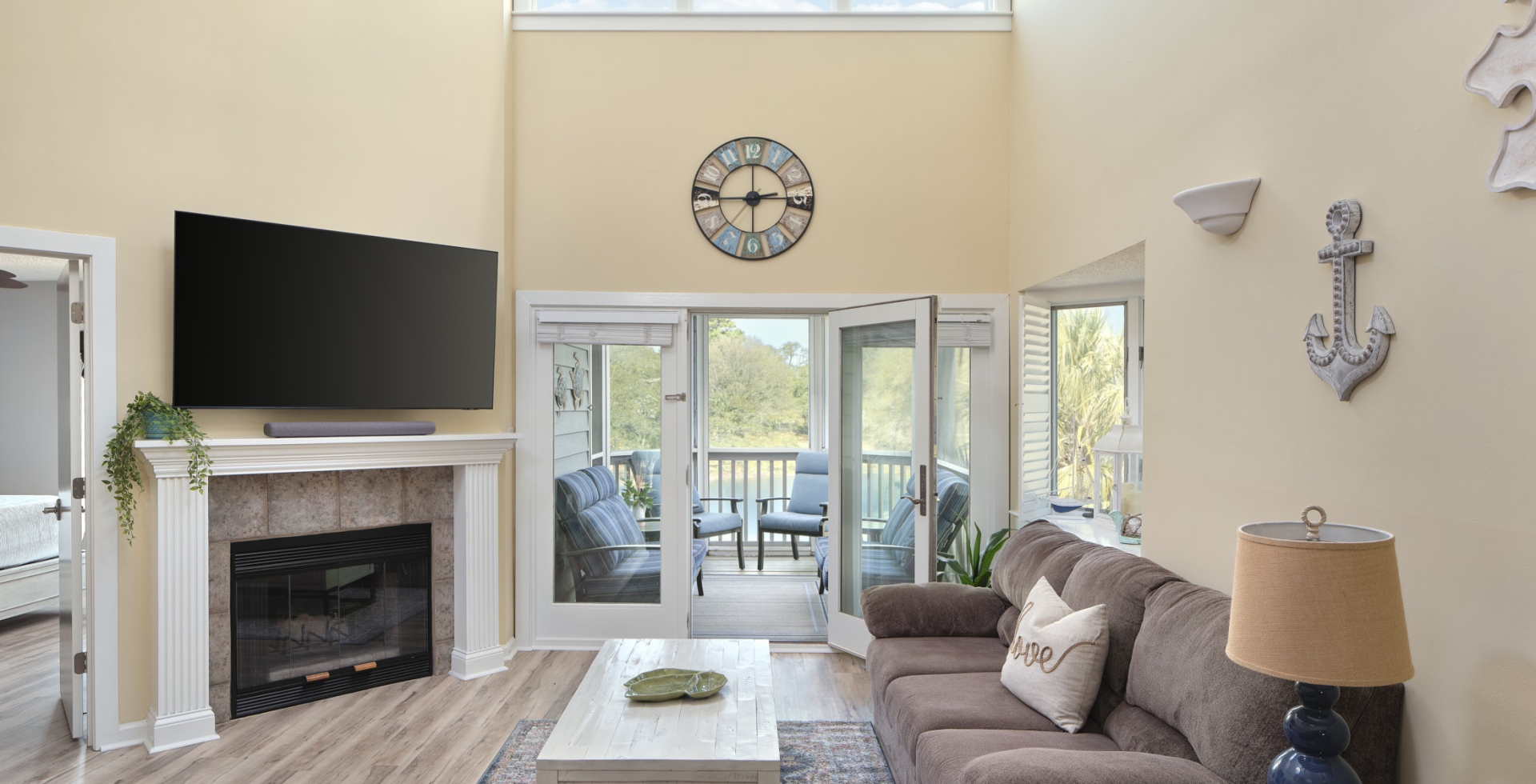 Windermere by the sea living room with patio access and a fireplace