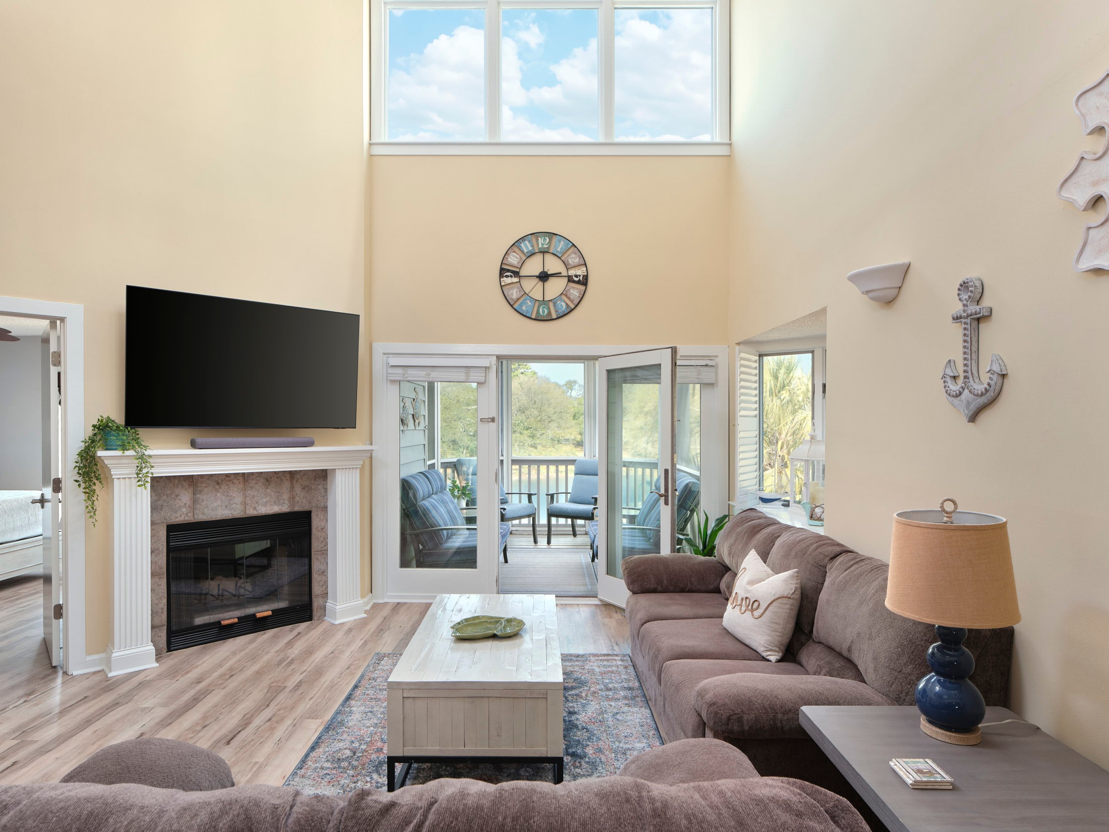 Windermere by the sea living room with patio access and a fireplace