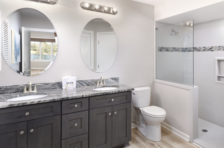 Windermere by the Sea master bath with double sinks and a walk-in shower