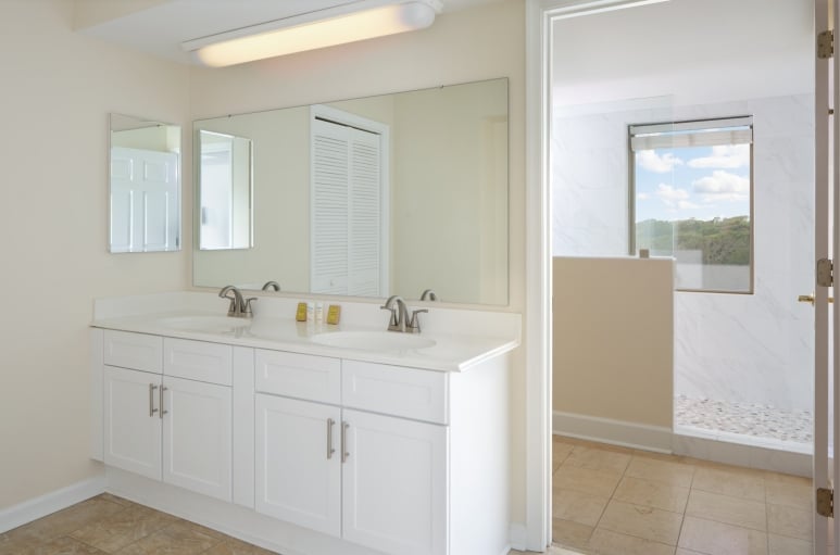 Brighton bathroom with double sinks and a walk in shower