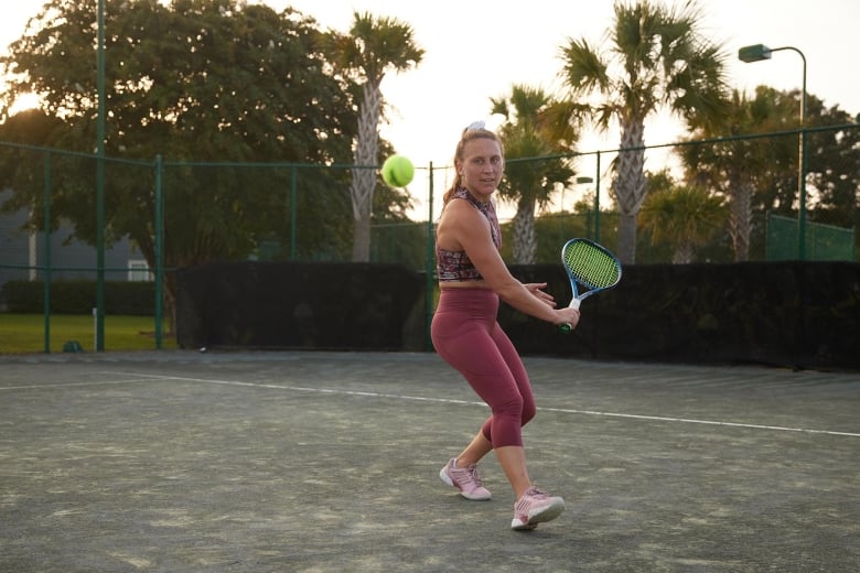 Woman playing tennis at 78 Fitness