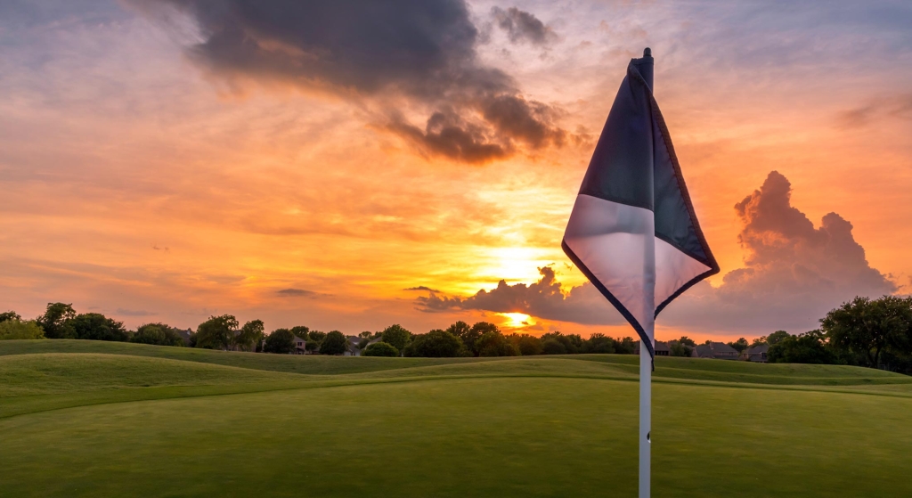 Golf flag at sunset