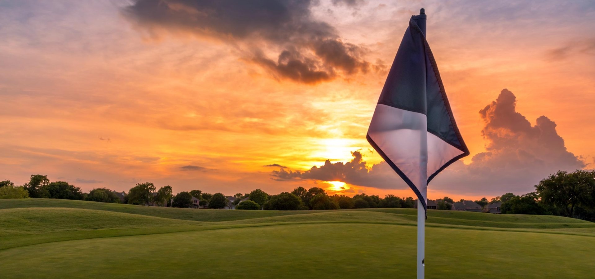 Golf flag at sunset