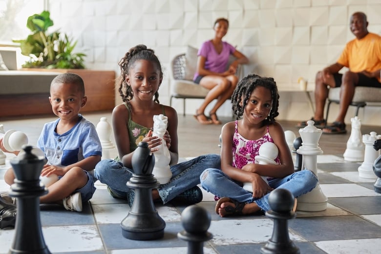 Kids with giant chess set