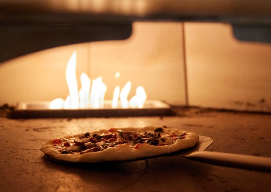 Pizza in wood-fired oven
