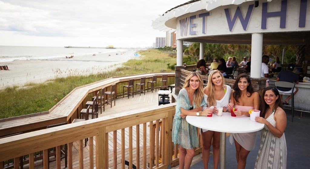 Girl Friends with drinks at Wet Whistle bar