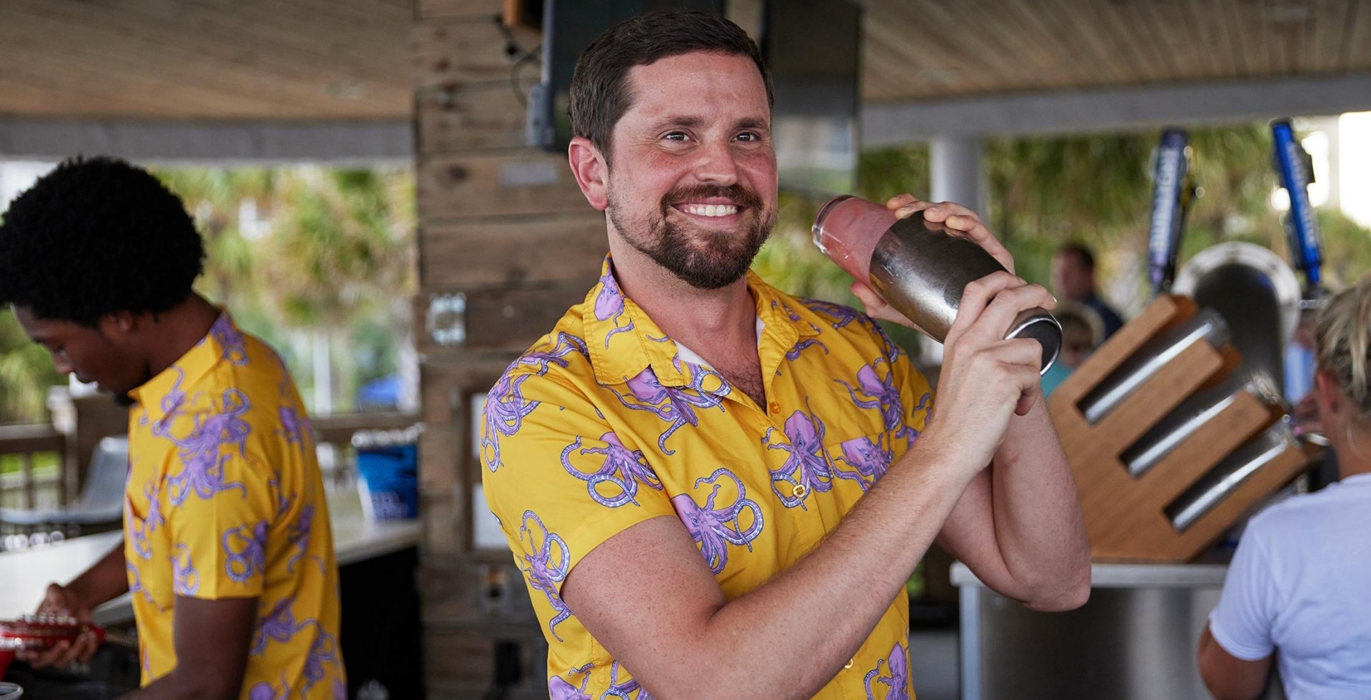 Bartender shaking drink at Wet Whistle beach bar