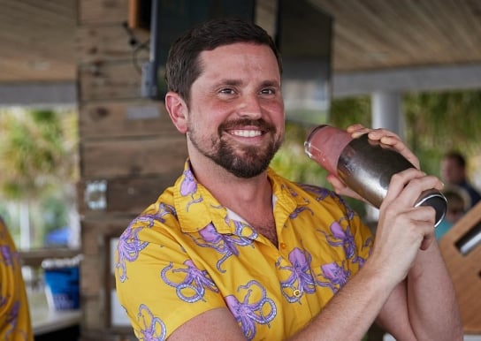 Bartender shaking drink at Wet Whistle beach bar
