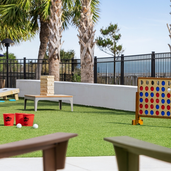 Currents Seaside Entertainment activity lawn with Giant Jenga, Giant Connect 4, Cornhole, and other games for the family