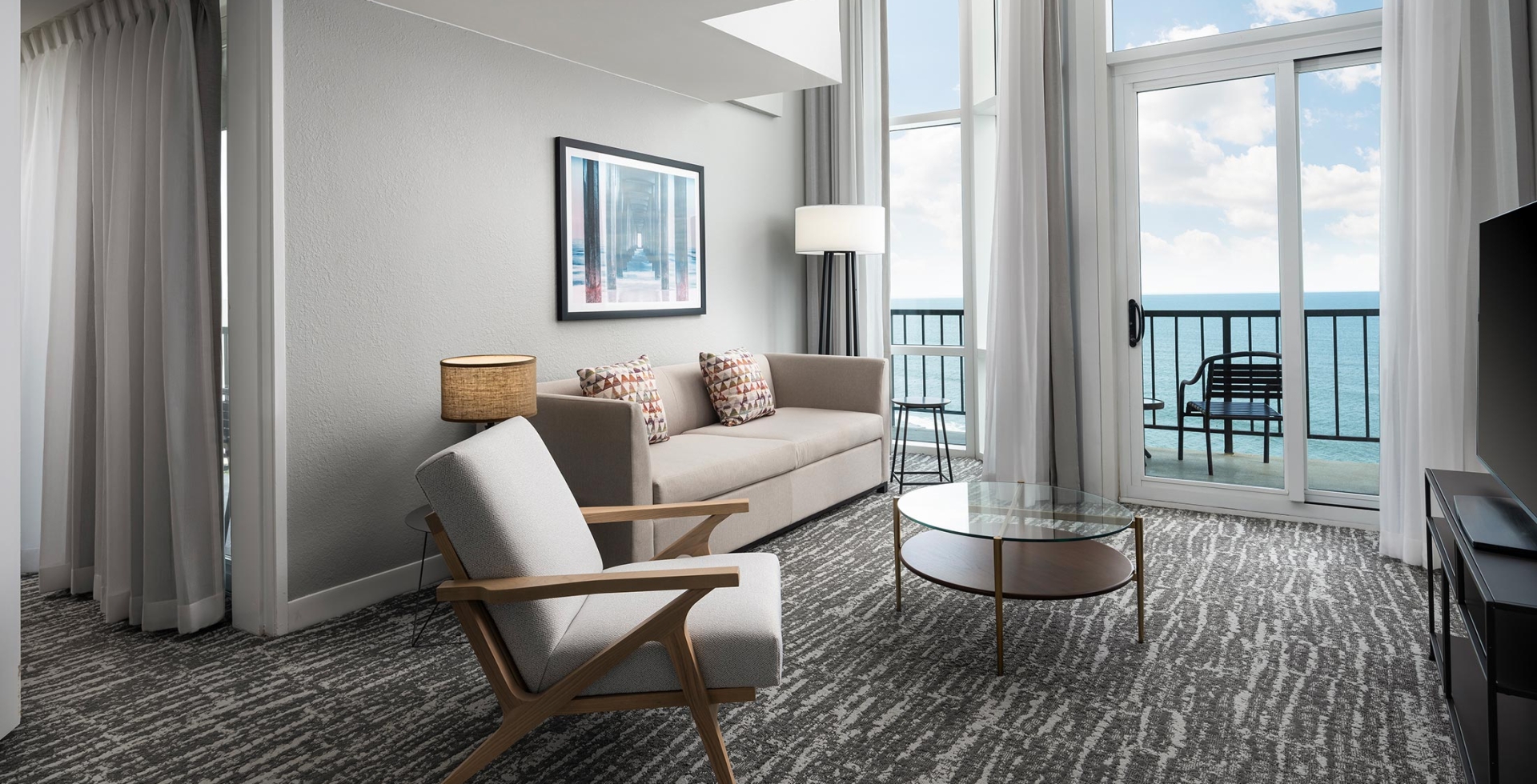 Hilton Hotel living room with ocean view balcony access