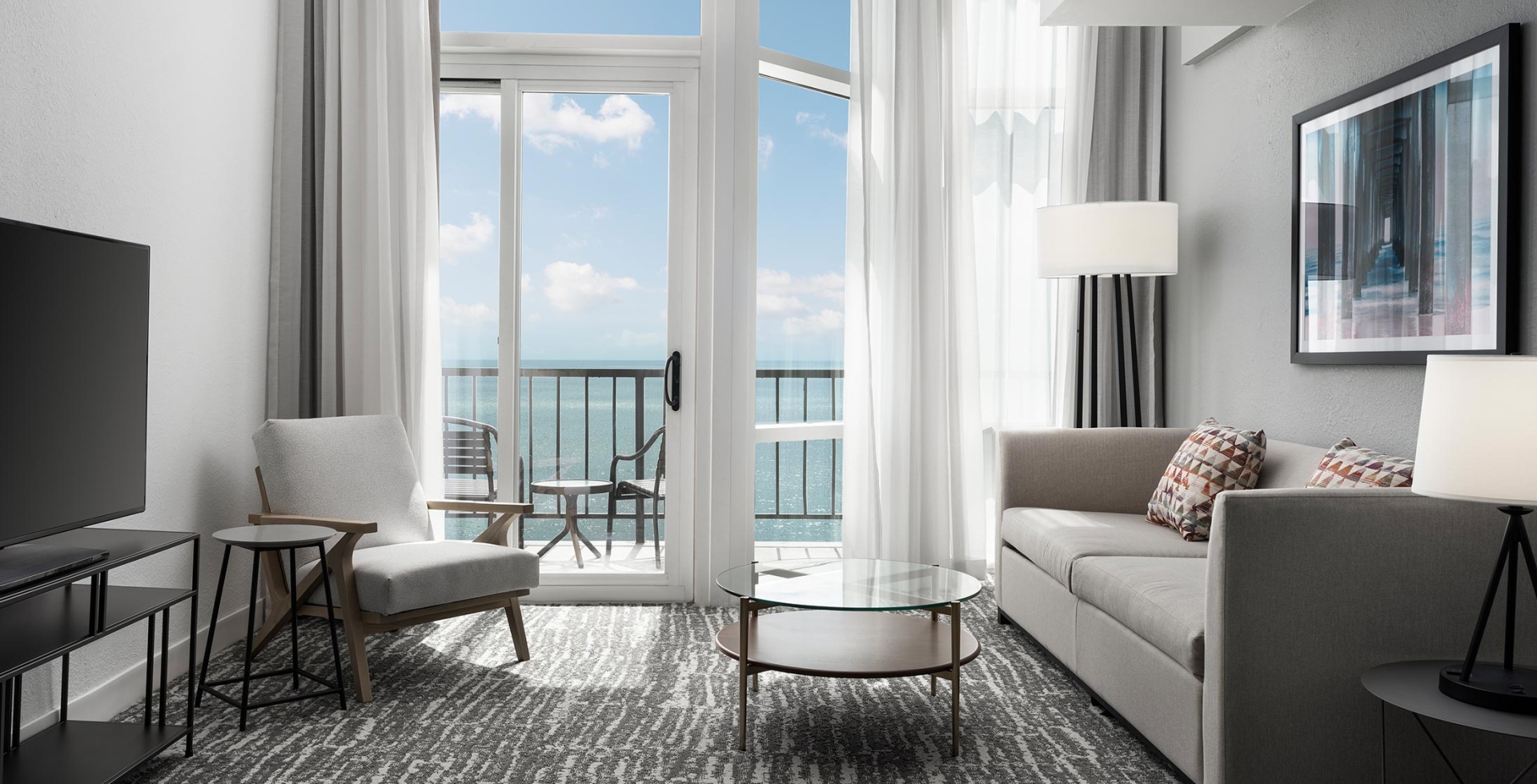 Hilton Hotel living room with ocean view balcony access