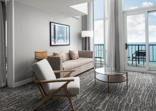 Hilton Hotel living room with ocean view balcony access