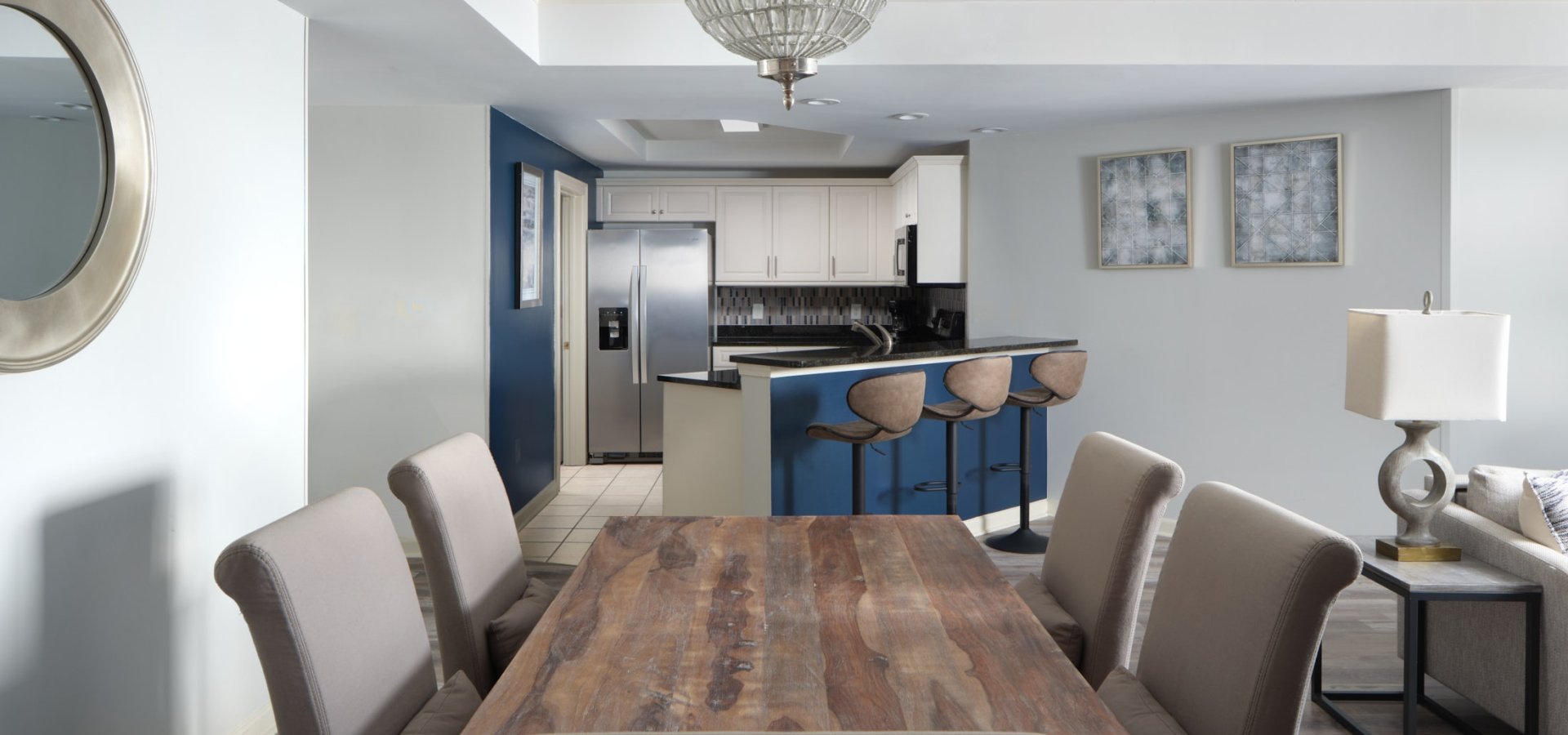 Royale Palms dining table with the kitchen and breakfast bar in the background