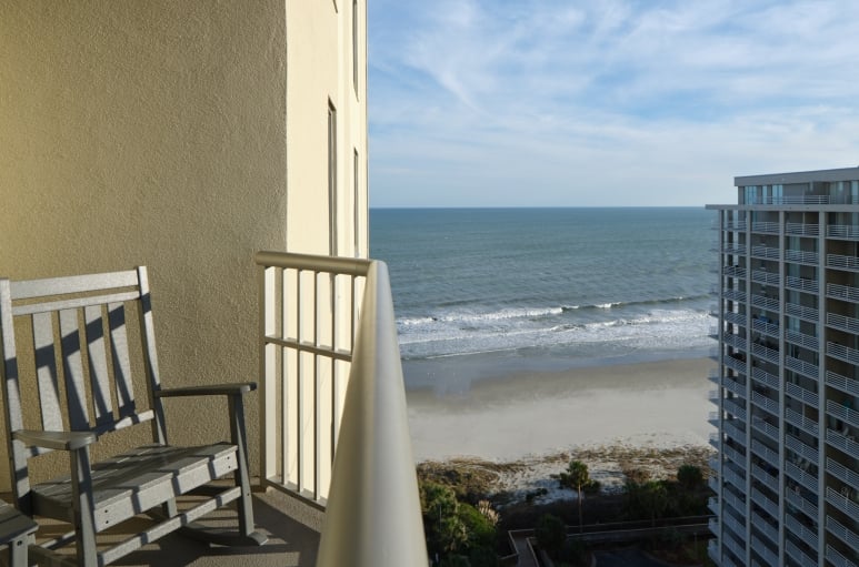 Royale Palms Ocean view balcony with rocking chairs