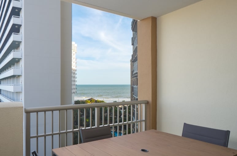 Royale Palms Oceanview Balcony with a table and chairs