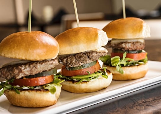 Three burger sliders on a plate