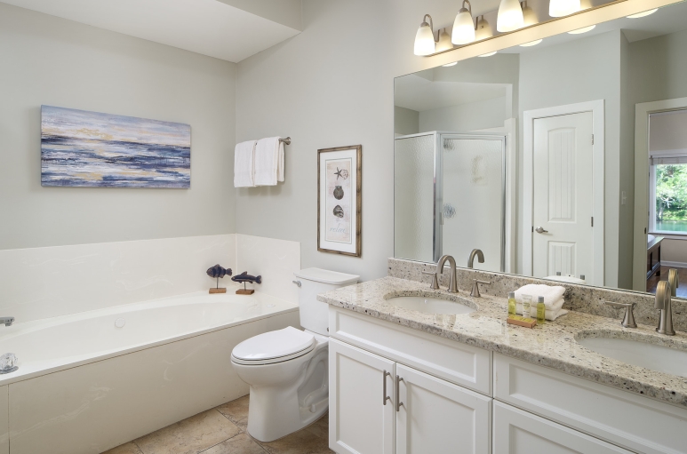 Windermere by the Sea double sink bathroom with a tub