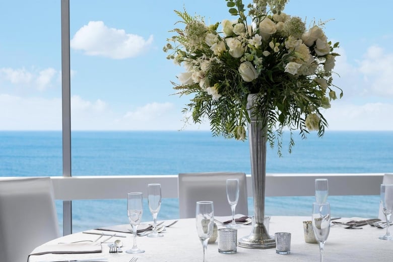 Close up of wedding table set up with flowers in Dunes Ballroom