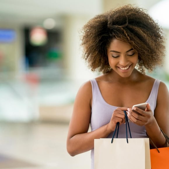 Woman shopping and looking at phone