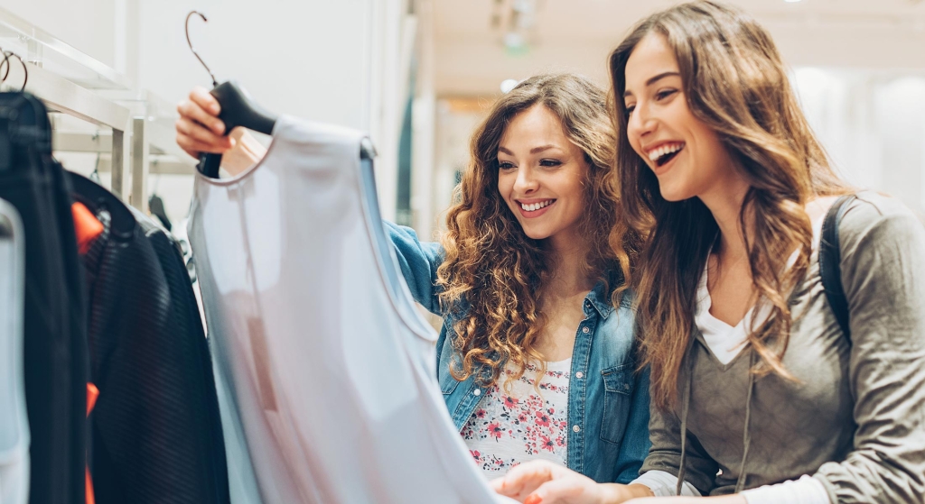 Women shopping looking at clothing