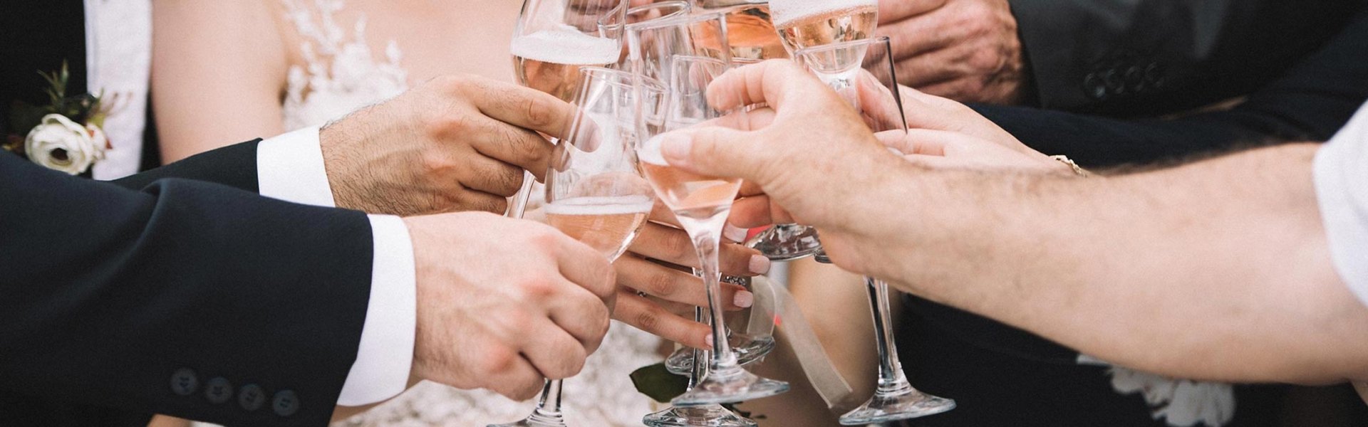 Wedding party cheering champagne together