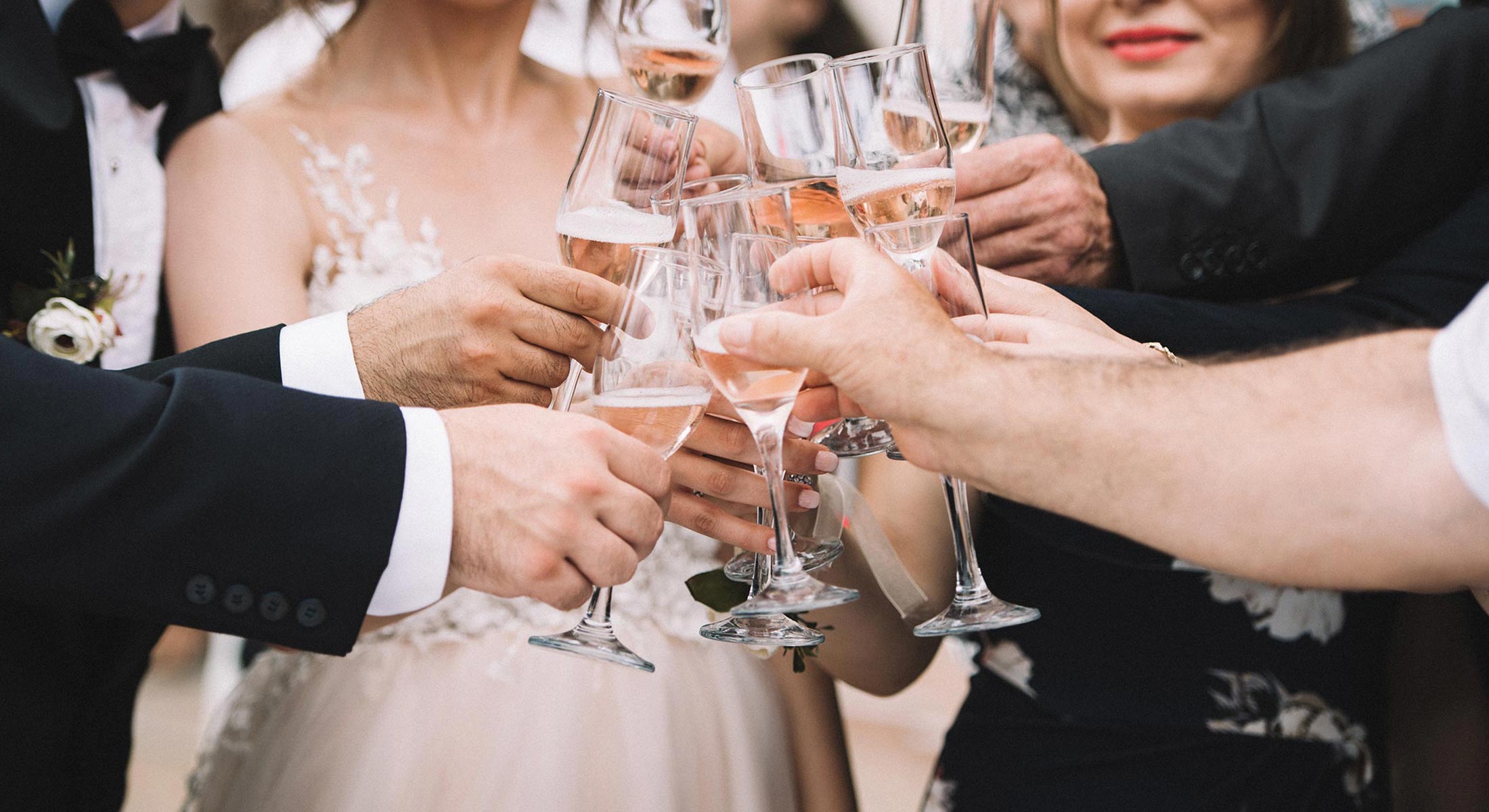 Wedding party cheering champagne together
