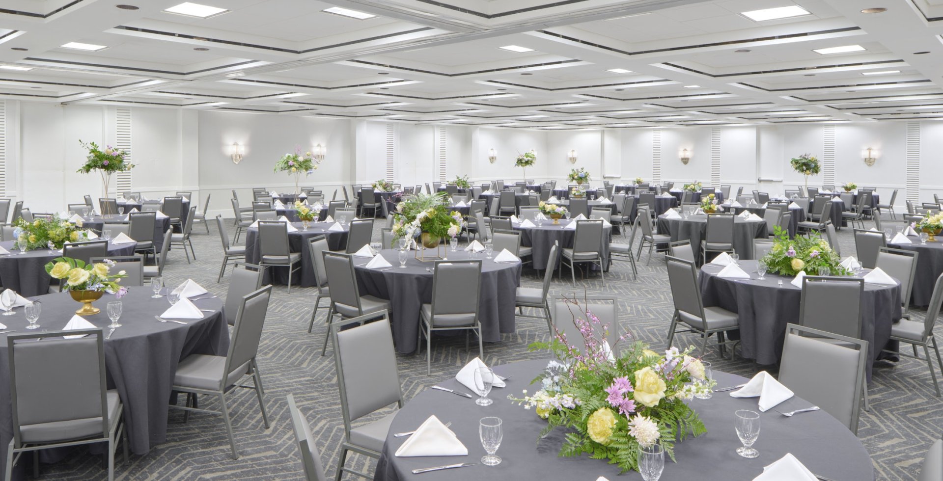 Hilton Ballroom set up in rounds for a dinner reception