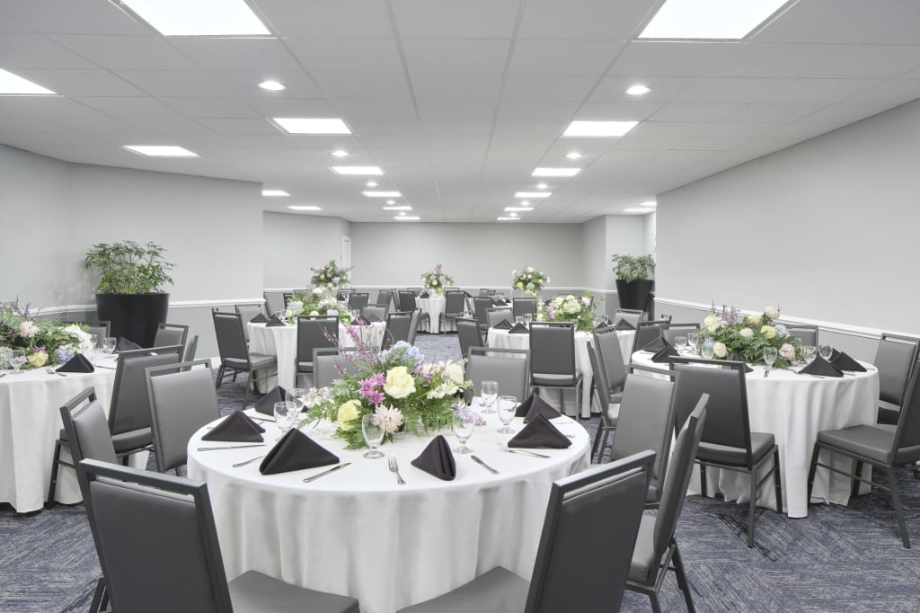Mulligans set with round tables for a rehearsal dinner
