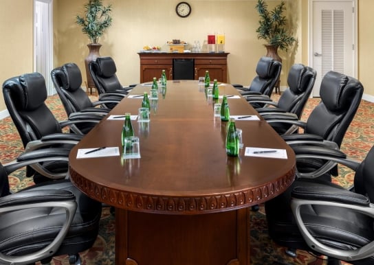 Palmetto Palms executive meeting space with refreshment table