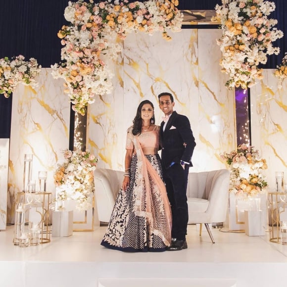 Bride and Groom together with extravagant decor including sparklers