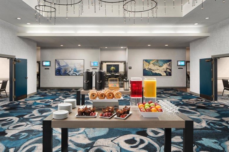 Windsor Foyer Break with coffee, juice, bagels, fresh fruit, and assorted muffins.