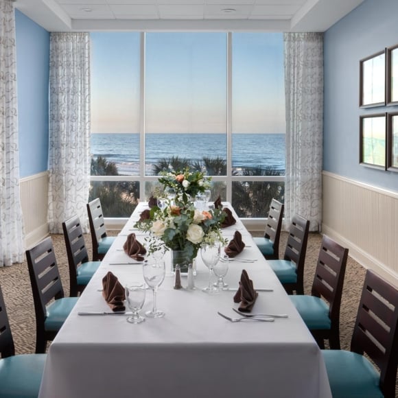 Cafe Amalfi private dining room long table set up with ocean views