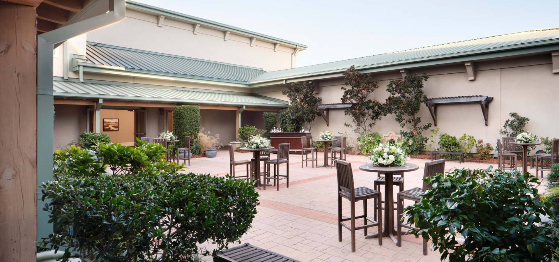 The Plaza outdoor reception area with high top tables and chairs