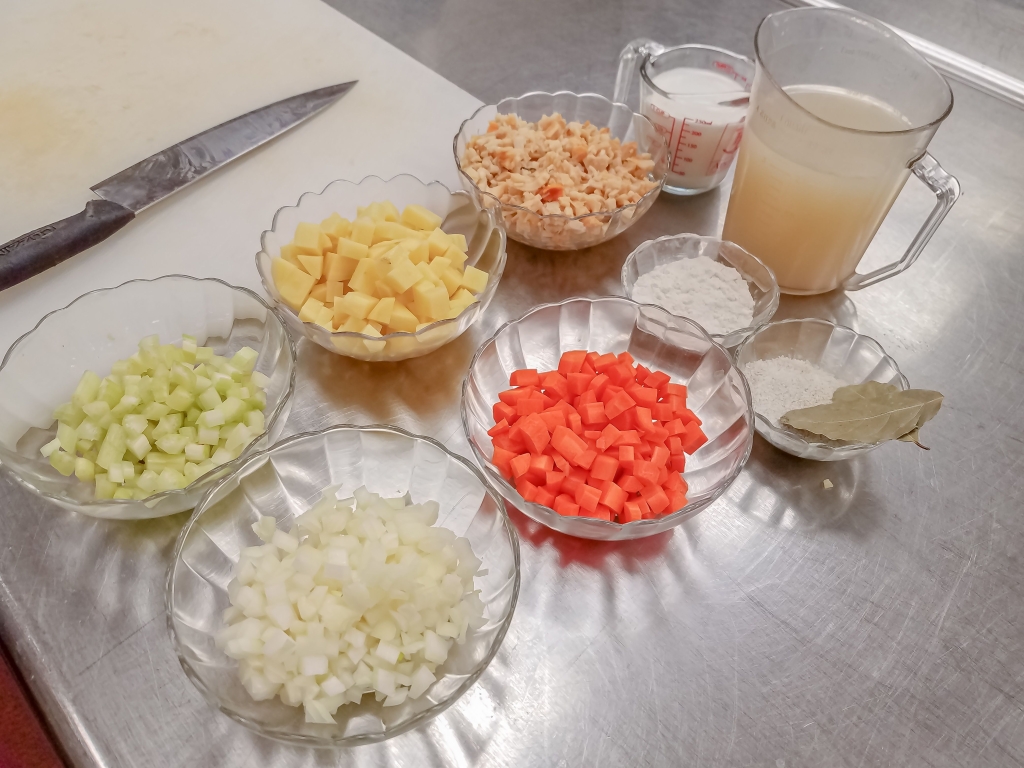 Bowls of seafood chowder ingredients