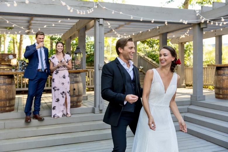 Bride and Groom with two friends are enjoying their evening on the deck