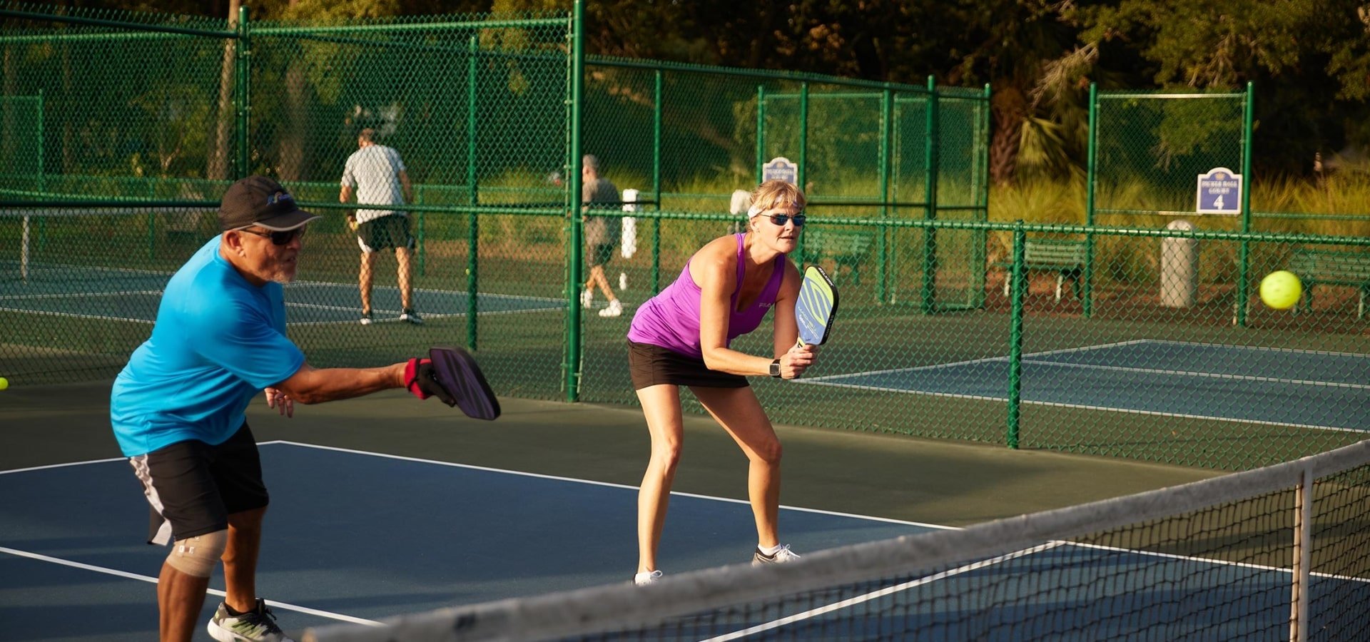 Two people playing pickleball at Kingston Resorts