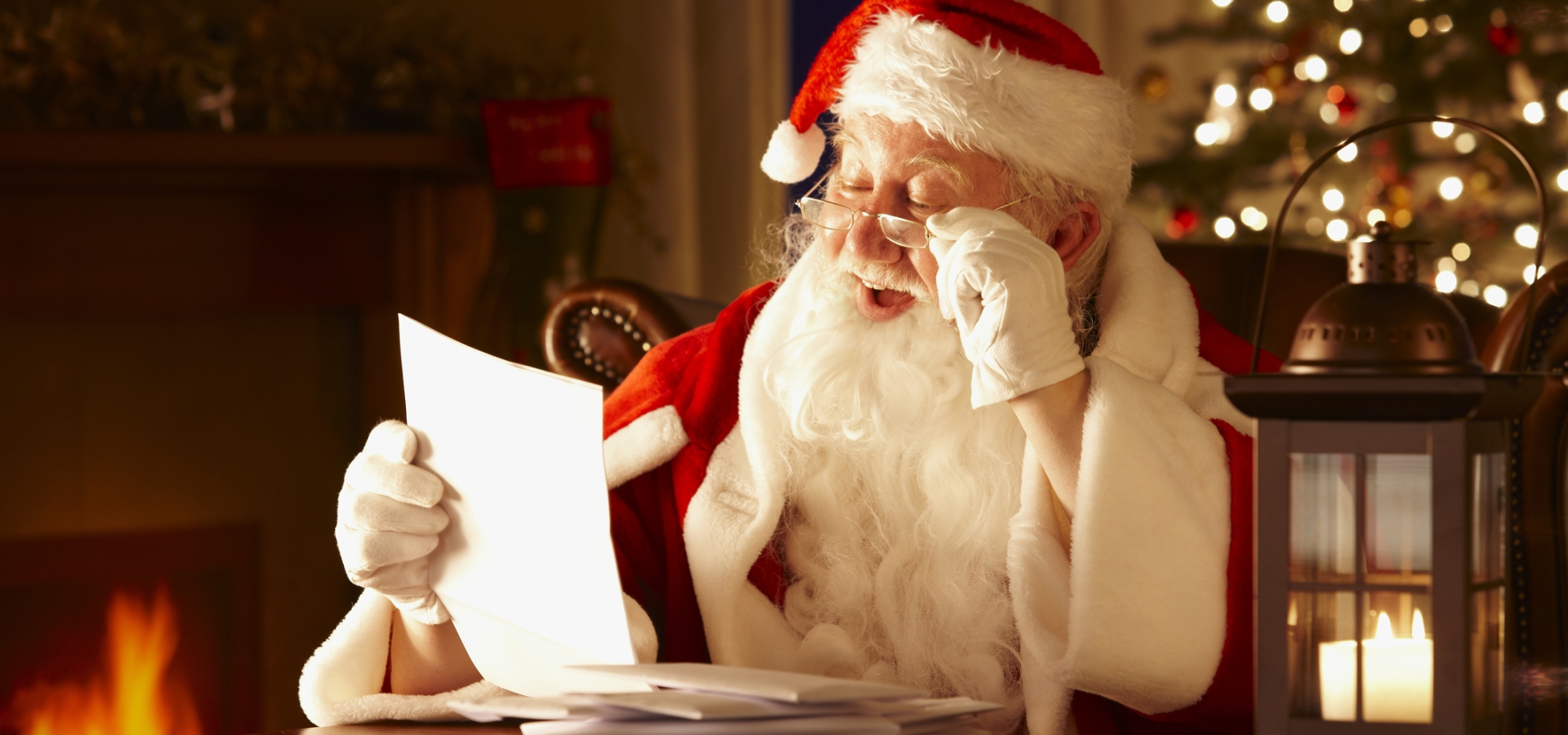 Santa Clause reading letters from children