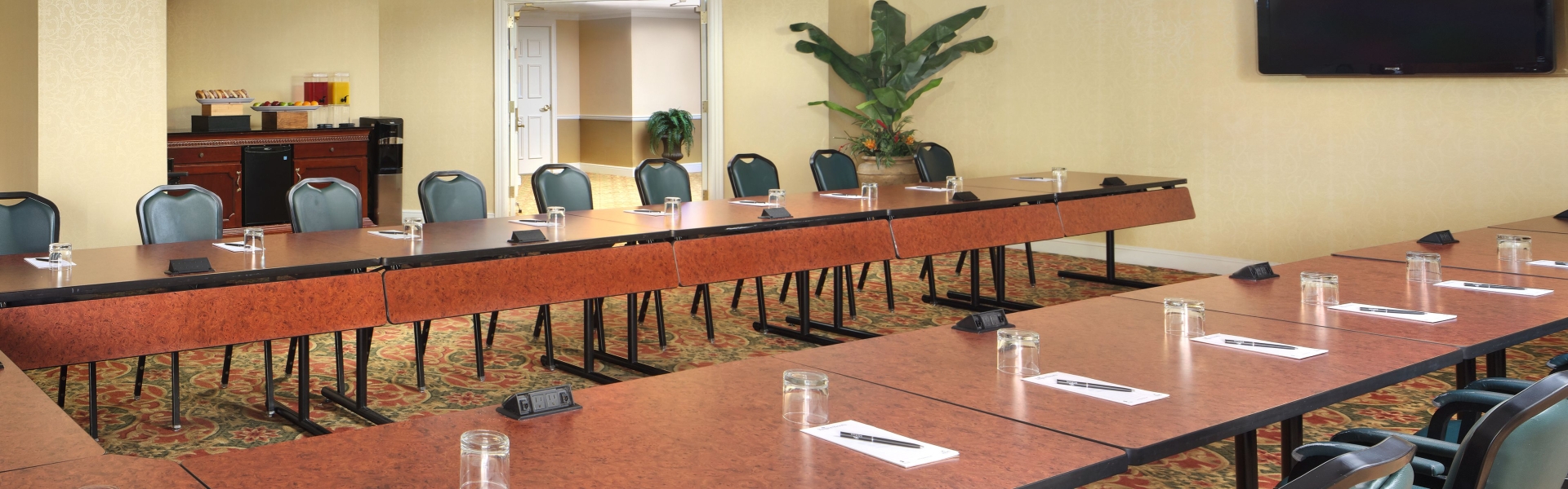 Savannah Palms meeting space set up U Shape with refreshments table