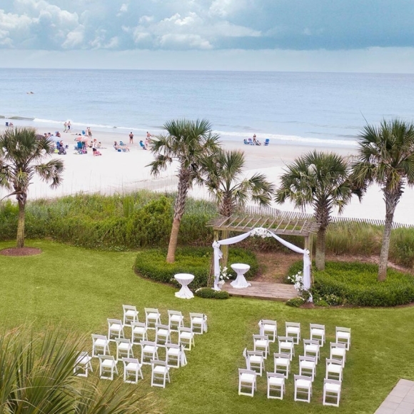 Wedding on lawn by beach