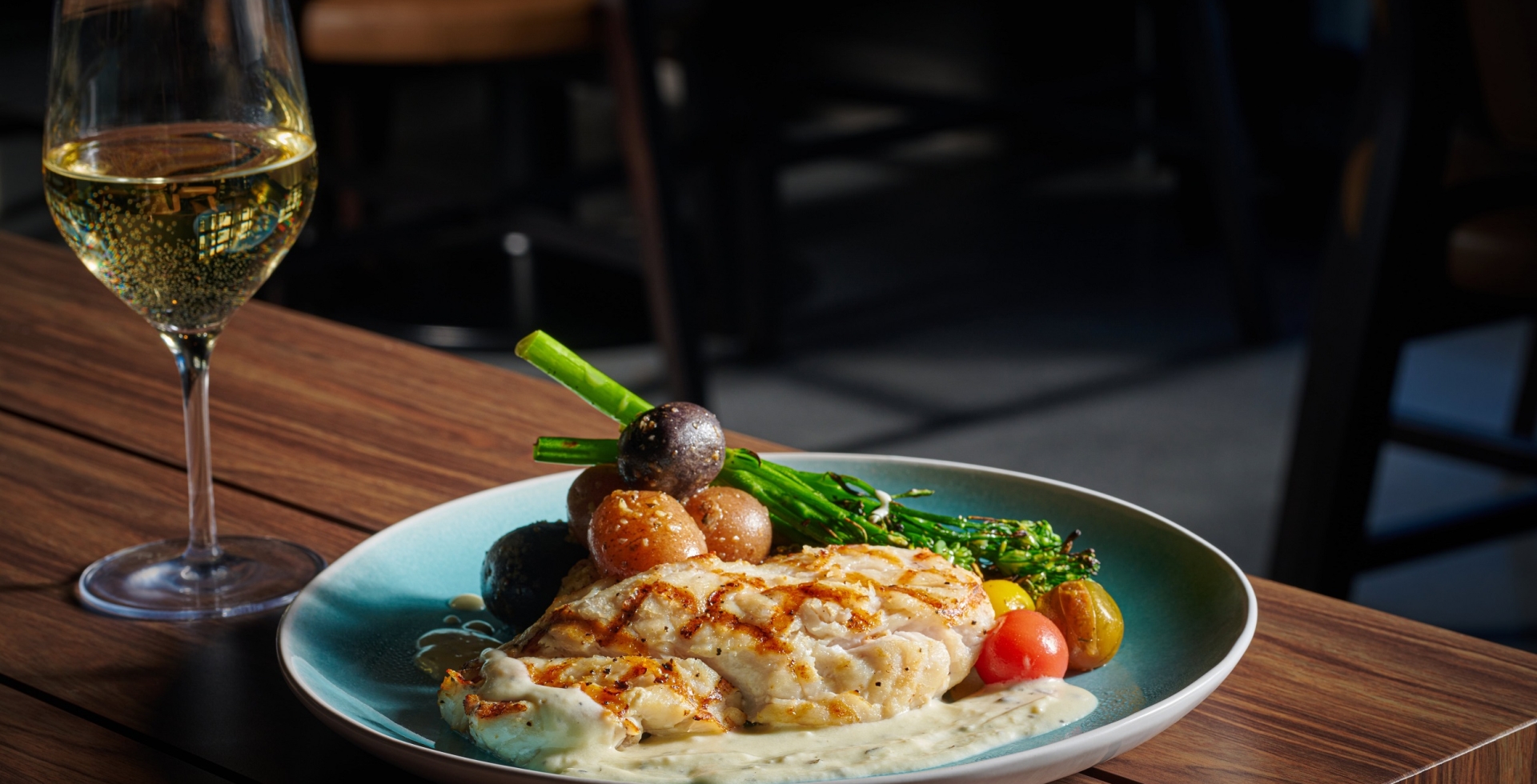 Black Drum Brewing seafood dish with asparagus, paired with white wine