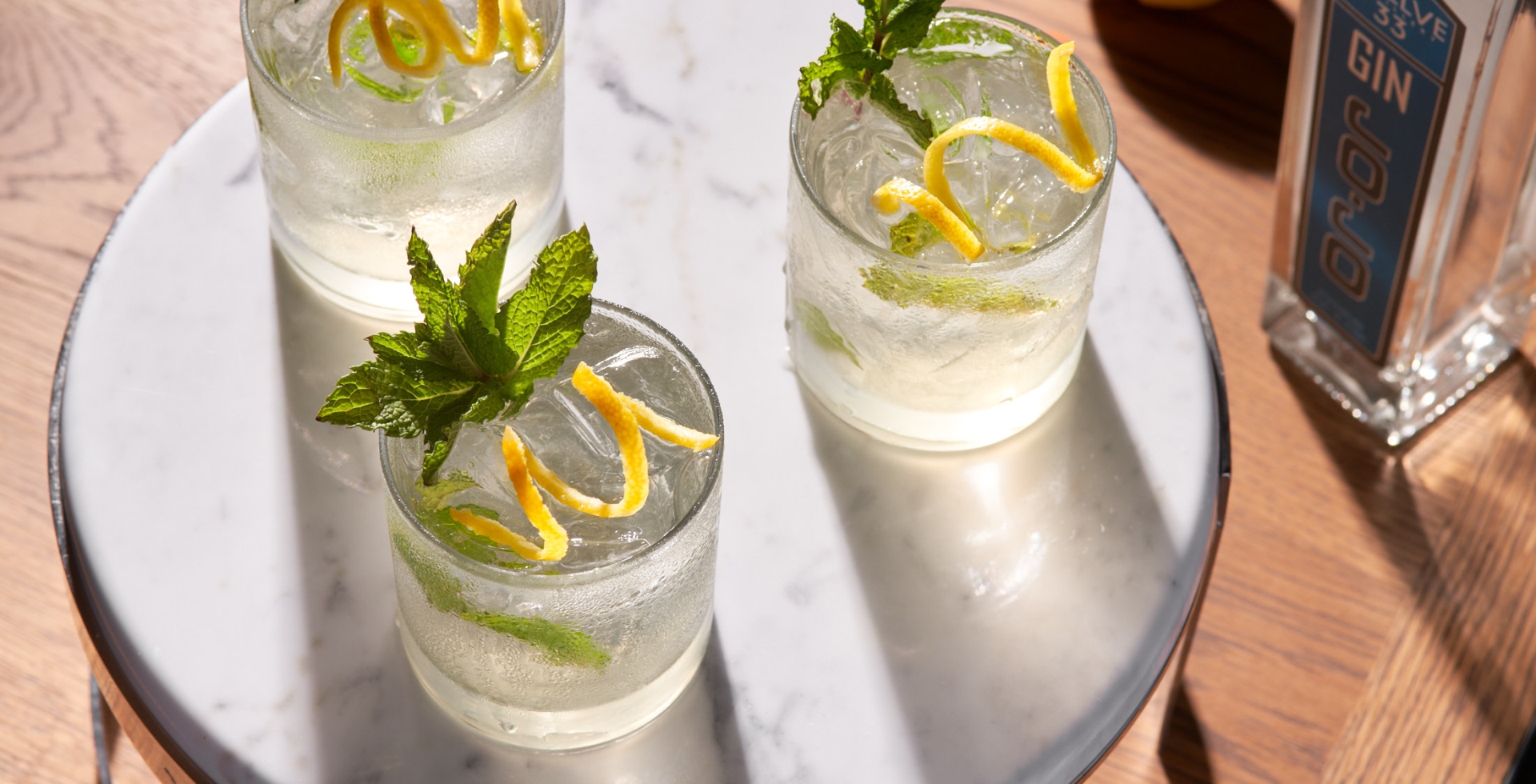 Black Drum Brewing Twelve 33 Distillery cocktail with mint garnish and lemon twist